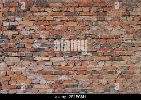Detail of withered red brick wall Stock Photo