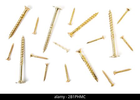 Background from yellow zinc screws. Torx screw on white background Stock Photo