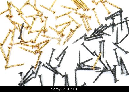 Background from yellow zinc screws. Torx screw on white background Stock Photo