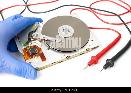 Hdd - hard disk drive. Hard disk repair concept, computer industry. Disassembled hard drive from the computer 3.5' SATA on white background Stock Photo