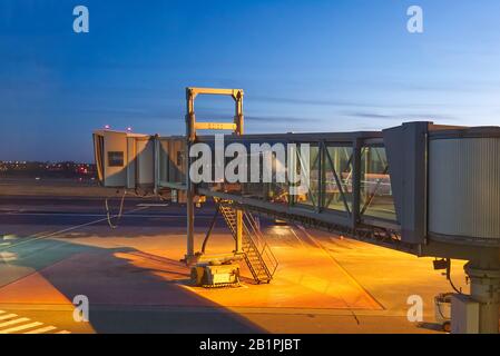 walkway for passengers boarding at airoport. sleeve at the airport for boarding an airplane night shoot in Tallinn Stock Photo