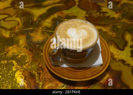 top down close up view cup of coffee latte with heart drawing. Stock Photo