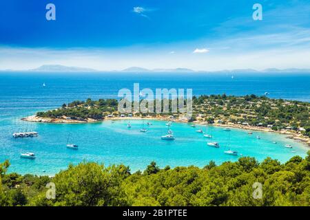 Panoramic view on Kosirina beach bay on Murter island in Croatia, anchored sailing boats and yachts on blue sea Stock Photo