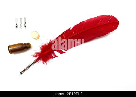 A red feather pen isolated on white background Stock Photo