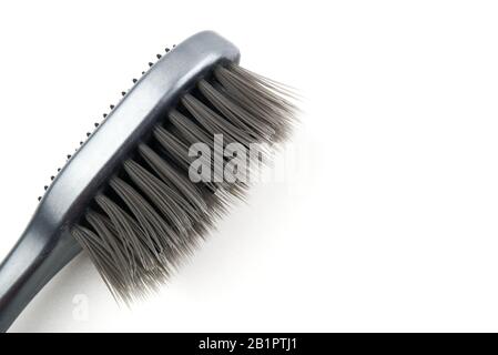black toothbrush close up isolated over white background. Stock Photo
