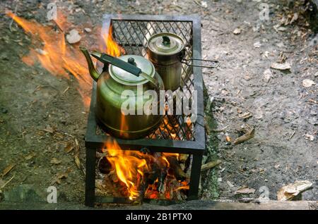 Cooking Tea in Camping Stock Photo