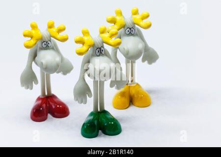 Umea, Norrland Sweden - February 12, 2020: three toy plastic elk with shoes Stock Photo