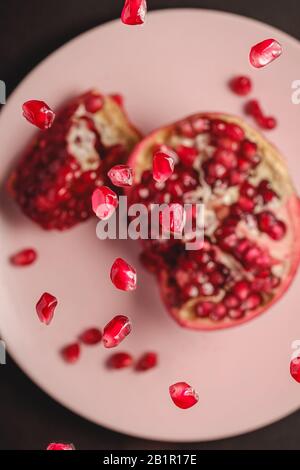A closeup selective color of a ripe pomegranate Stock Photo - Alamy