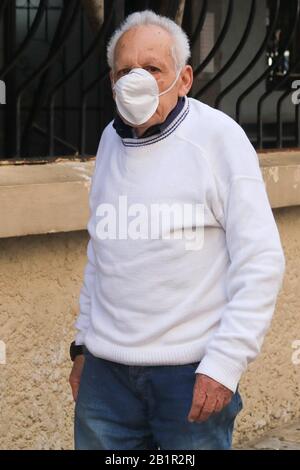 Beirut, Lebanon. 27 February 2020: A member of the public wearing a protective face mask in the Lebanese capital Beirut against the spread of covid 19 coronavirus. Lebanon  health ministry has announced a second coronavirus of a woman who was on a 7-day religious visit to Iran, and returned to Lebanon on February 20.Credit: amer ghazzal/Alamy Live News Stock Photo