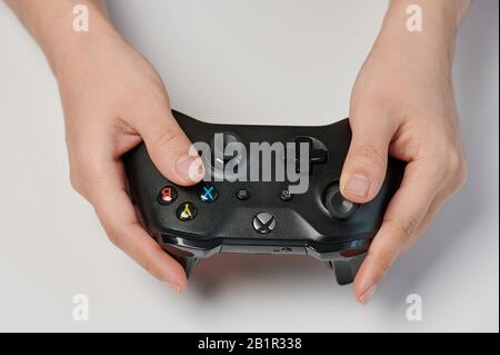 New-York , USA - February  11, 2020: Black xbox  one controller in hand close up view isolated Stock Photo