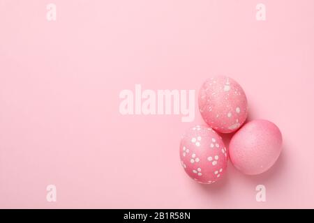 Easter eggs on pink background, space for text Stock Photo