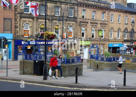 BARNSLEY, UK - JULY 10, 2016: People visit town centre of Barnsley, UK. Barnsley is a major town of South Yorkshire with population of 91,297. Stock Photo