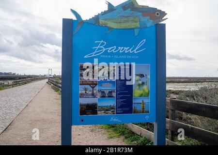 Tavira, Portugal - January 23, 2020: Sign welcomes visitors to Barril Island Beach, featuring a sandy shoreline, wetlands and the anchor cemetary Stock Photo