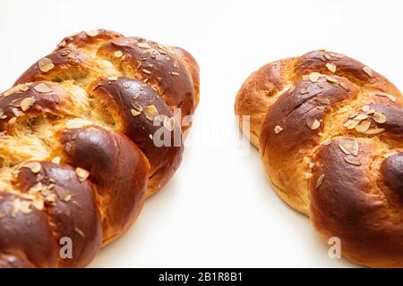 Sweet bread, easter tsoureki cozonac isolated on white background, closeup view. Braided brioche, festive traditional challah Stock Photo
