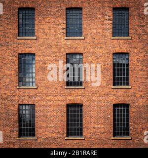 Details of the windows and brickwork in the old warehouse buildings at the Albert Docks in Liverpool