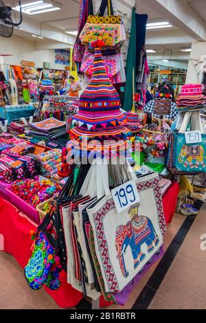 Akha hill tribe huzzah hats and other popular souvenirs, Talat Warorot, market hall, Chiang Mai, Thailand Stock Photo