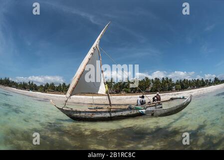 sailing with a sail boat in Kenya, Zanzibar and Maldives in beautiful crystal Turquoise water on white sand tropical beach. Traditional fishing wooden Stock Photo