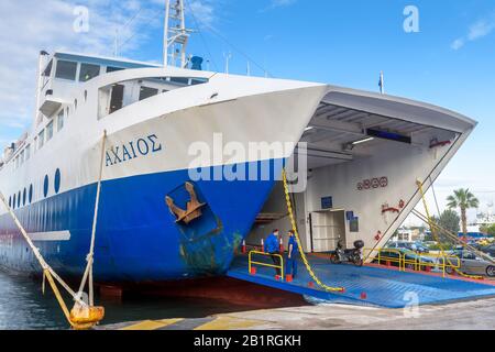 Piraeus, Greece - May 7, 2018: Car-ferry docked in seaport near Athens. Large ship in a sea harbor close-up. Ferryboat loading or unloading by a port Stock Photo