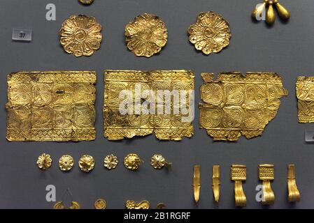 Athens - May 7, 2018: Gold jewellery from old Greek Mycenae. Golden decorations in the National Archaeological Museum in Athens, Greece. Precious patt Stock Photo