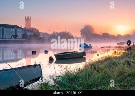 On the riverbanks of the river Taw, Barnstaple, with moored rowing boats on the river bank , North Devon, South West, UK Stock Photo