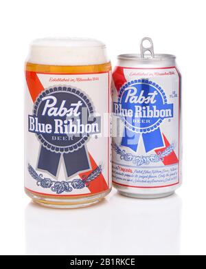 IRVINE, CALIFORNIA - MARCH 16, 2017: Pabst Blue Ribbon Beer. A glass and can of the American brand introduced in 1884 in Milwaukee, currently based in Stock Photo