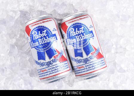 IRVINE, CALIFORNIA - MARCH 16, 2017: Pabst Blue Ribbon Beer. Two cans of the American brand on a bed of ice, introduced in 1884 in Milwaukee, currentl Stock Photo