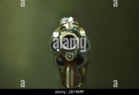 revolver gun muzzle ready to shoot on black background Stock Photo