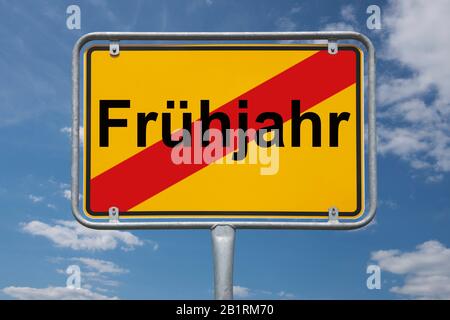 Inscription Frühjahr (spring) on a traffic sign, place-name sign Germany, end of the town Stock Photo