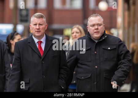 London, UK. 27th Feb, 2020. Britain First leader Paul Golding walks to Westminster Magistrates’ Court in London to face charges under the Terrorism Act. The image captures a candid moment as Golding approaches the court building, dressed formally and accompanied by others. Penelope Barritt/Alamy Live News Stock Photo
