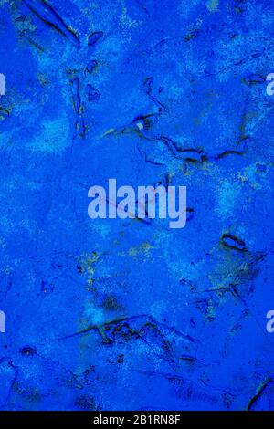 closeup of a rustic high blue plastered wall to be used as a background Stock Photo