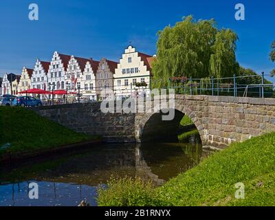 Canal bridge and houses in Friedrichstadt, North Frisia, Schleswig-Holstein, Germany, Stock Photo