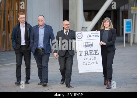 Edinburgh, UK. 27 February 2020. Pictured: (L-R) Ross Greer MSP; Andy Wightman MSP; Patrick Harvie MSP; Alison Johnstone MSP. Ahead of the budget debate this afternoon Scottish Greens Parliamentary Co-Leaders Alison Johnstone MSP and Patrick Harvie MSP along with the Green MSP group will stage a photocall outside the Scottish Parliament to celebrate their free bus travel for under 19s budget win. The Scottish Greens yesterday announced that a deal had been struck on free bus travel, more money for councils, extra resource for community safety and an additional £45 million package to tackle Stock Photo