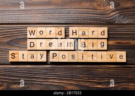 Work hard dream big stay positive word written on wood block. Work hard dream big stay positive text on wooden table for your desing, Top view concept Stock Photo