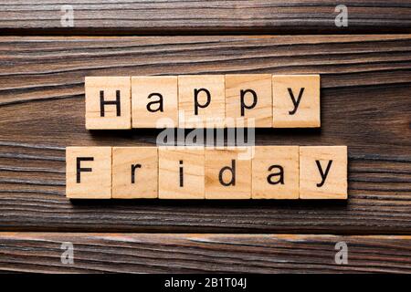 Happy friday word written on wood block. Happy friday text on wooden table for your desing, concept. Stock Photo