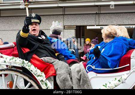 St. Paul, MN/USA - January 25, 2020: Senior royalty rides in carriage during annual grande day parade of winter carnival. Stock Photo