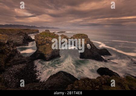 Gatklettur arch in Arnarstapi town in Snæfellsnes peninsula, West Iceland. Stock Photo