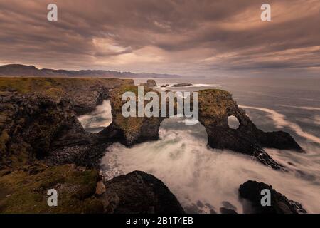 Gatklettur arch in Arnarstapi town in Snæfellsnes peninsula, West Iceland. Stock Photo