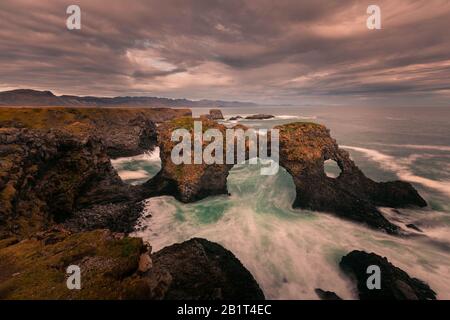 Gatklettur arch in Arnarstapi town in Snæfellsnes peninsula, West Iceland. Stock Photo