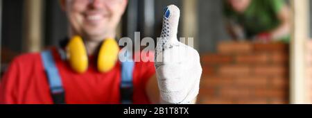Happy smiling male worker showing thumb up gesture Stock Photo