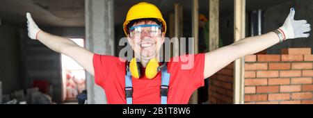 Smiling happy friendly caucasian male showing building area Stock Photo