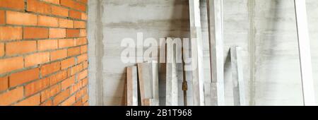 Set of finishing building tools standing at wall Stock Photo