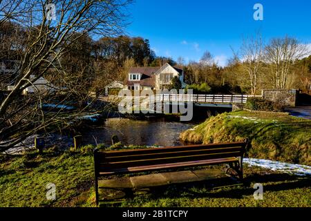 The Lyne Water flowing through the village of West Linton in the Scottish Borders, 16 miles south of Edinburgh, Scotland Stock Photo