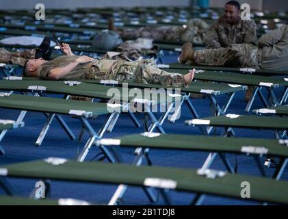 Hagenow, Germany. 27th Feb, 2020. A US soldier is resting in a dormitory in the Ernst Moritz Arndt Barracks of the German Armed Forces. The soldiers will take a break here before continuing on to the major NATO exercise 'Defender Europe 2020'. After spending the night and refuelling and servicing their vehicles, the convoy will continue its journey eastwards in the evening. More US transports are expected in the next few days, with a total of 1,700 US soldiers expected to pass through Mecklenburg-Western Pomerania by March 6. Credit: Jens Büttner/dpa-Zentralbild/dpa/Alamy Live News Stock Photo