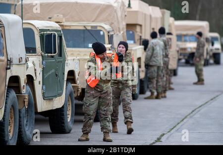 Hagenow, Germany. 27th Feb, 2020. The first 120 US soldiers are preparing in the Ernst Moritz Arndt barracks of the Bundeswehr for their onward journey to the NATO major exercise 'Defender Europe 2020'. After spending the night and refuelling and servicing their vehicles, the convoy will continue its journey east in the evening. More US transports are expected in the next few days, with a total of 1,700 US soldiers expected to pass through Mecklenburg-Western Pomerania by March 6. Credit: Jens Büttner/dpa-Zentralbild/dpa/Alamy Live News Stock Photo