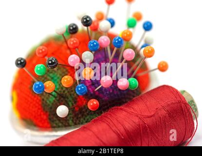 Sewing utensils against white background Stock Photo