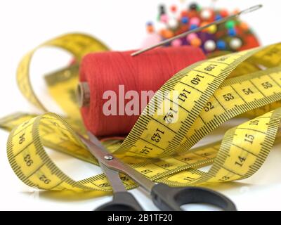 Sewing utensils against white background Stock Photo