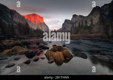 View from Valley View at Yosemite National Park. At the left side 'El Capitan' dome and at the right side Cathedral Rocks. In California. Stock Photo