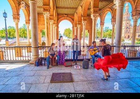 SEVILLE, SPAIN - OCTOBER 1, 2019: Plaza de Espana is the best place to find the group of street dancers, performing emotional and passionate flamenco Stock Photo