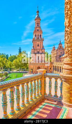 The view on the tower on Plaza de Espana feom the balcony, decorated with Andalusian tiles, Seville, Spain Stock Photo