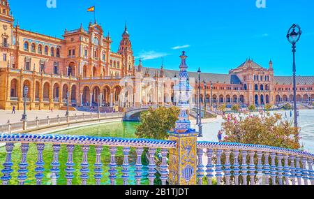 SEVILLE, SPAIN - OCTOBER 1, 2019: The ceramic decorations of Plaza de Espana are the masterpieces of Andalusian tiles art, October 1 in Seville Stock Photo